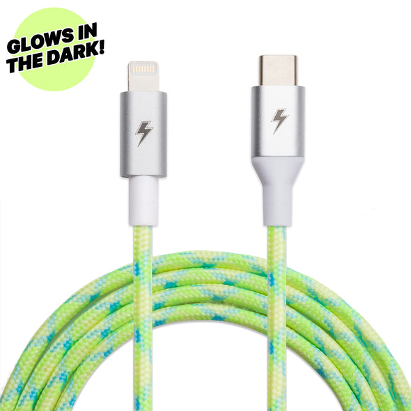 Introducing the ChargeCords Lime USB-C to Lightning Cable [10 ft / 3m length], featuring a neon green and blue braided fabric that glows in the dark! This Apple MFi Certified cable charges your iPhone up to 2x faster. "GLOWS IN THE DARK!" is proudly displayed in the top left corner.
