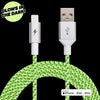 Introducing the ChargeCords Black and White Glow Lightning Cable — a 5 ft / 1.5m long USB cable featuring a braided design that glows in the dark. The cable includes a Lightning connector on one end and a standard USB on the other, with reinforced aluminum shielding for enhanced durability. Text at the top left corner reads "GLOWS IN THE DARK!" This Apple MFi Certified lightning cable is compatible with iPhone, iPad, and iPod.