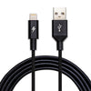 Close-up of a black Shade Lightning Cable by ChargeCords, 12 inches (.3m) in length and braided for durability. Compatible with iPhone and Apple MFi Certified, it features a Lightning connector on the left marked by a lightning bolt symbol and a USB-A connector on the right displaying a USB logo. The cable is coiled neatly under the connectors.